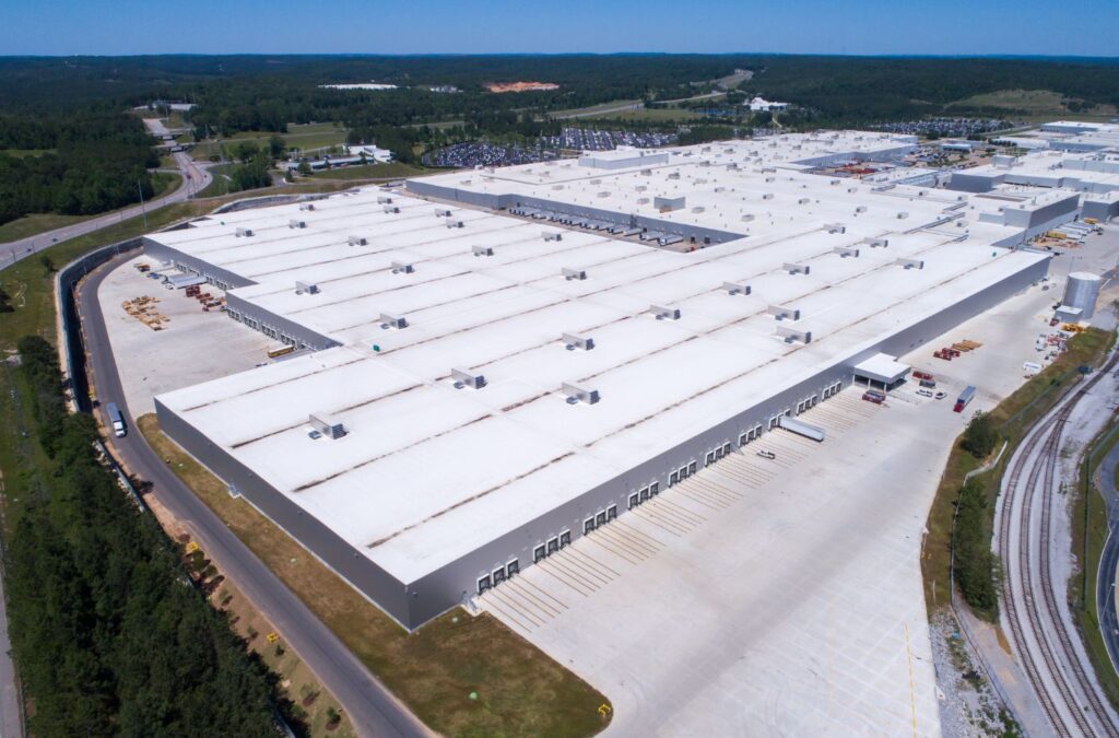 A Strive Roofing & Construction employee expertly performing TPO roofing in Houston, TX, using precision tools for durable and energy-efficient results.