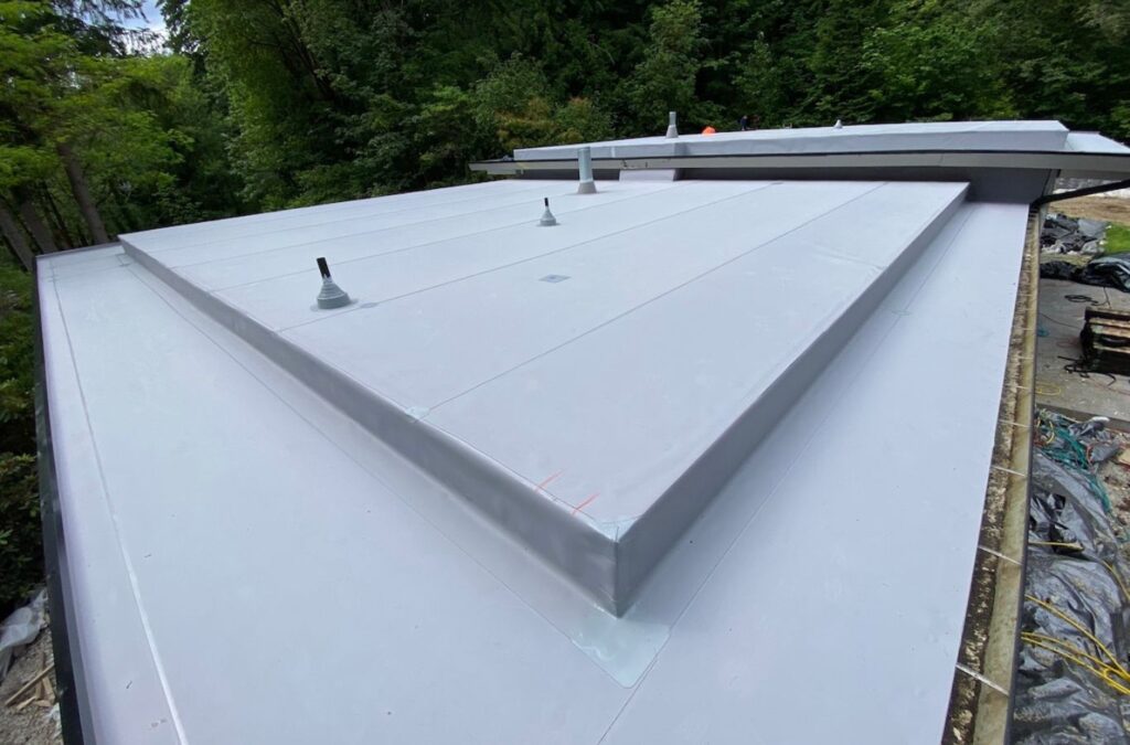 A Strive Roofing & Construction employee installing TPO Roofing in The Woodlands, TX using precision tools to deliver durable, energy-efficient results.