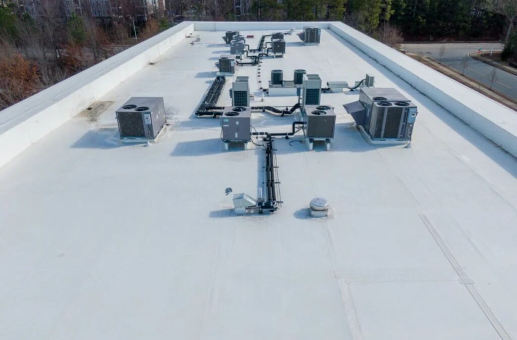 A Strive Roofing & Construction technician installing TPO Roofing in Kingwood, TX, highlighting top-level service and long-lasting commercial roofing systems. TPO Roofing near me.