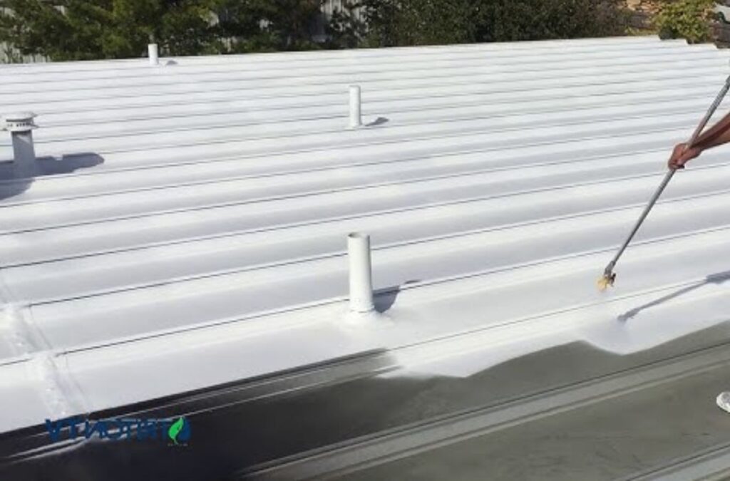 A Strive Roofing & Construction team member applying expert roof coating in The Woodlands, TX using precise tools for high-performance results.