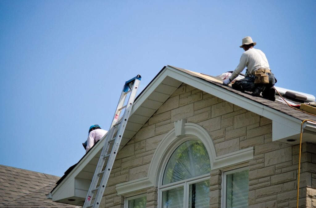 A Strive Roofing & Construction technician performing a detailed roof inspection in Houston, TX using advanced tools for accurate condition assessment.