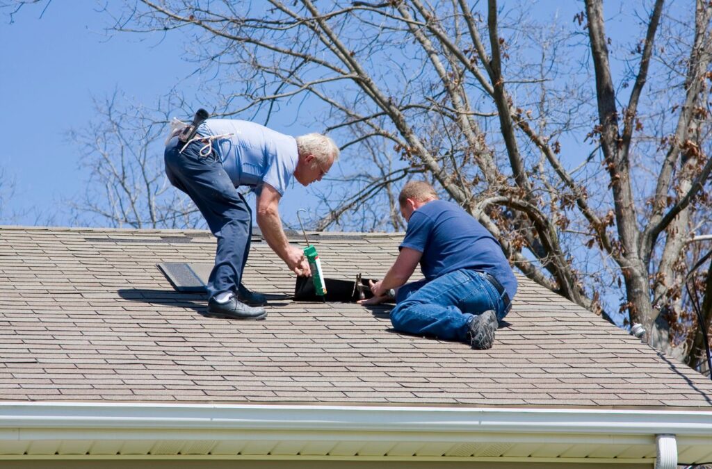 A Strive Roofing & Construction expert performing roof inspection in Humble, TX using precision tools to assess potential damage and ensure roof stability.