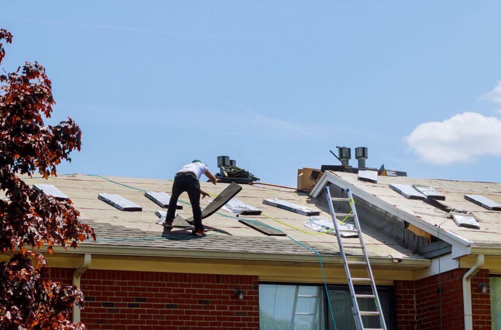 Strive Roofing & Construction team member working on residential roofing in Spring, TX ensuring durability and local expertise