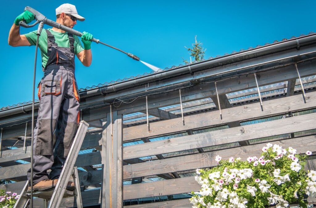 Strive Roofing & Construction team member cleaning roof in Spring, TX improving lifespan with local expertise