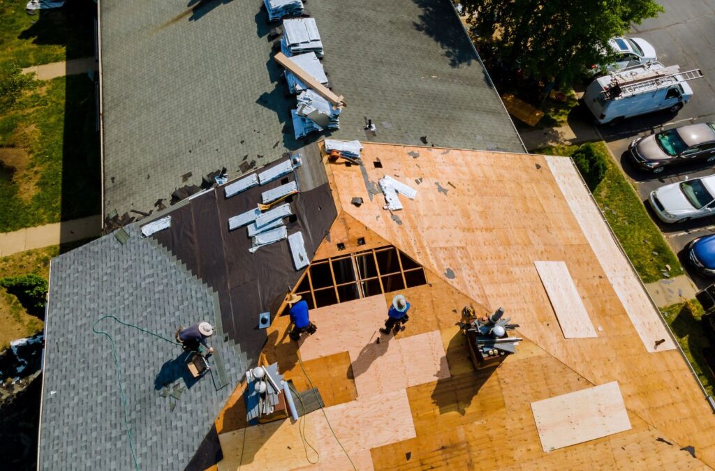 Strive Roofing & Construction crew installing commercial roofing in Spring, TX using advanced tools for durable finish