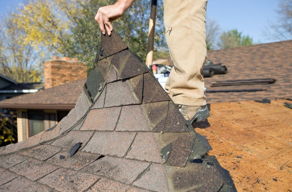 Strive Roofing & Construction technician repairing roof in Spring, TX using professional tools for lasting protection