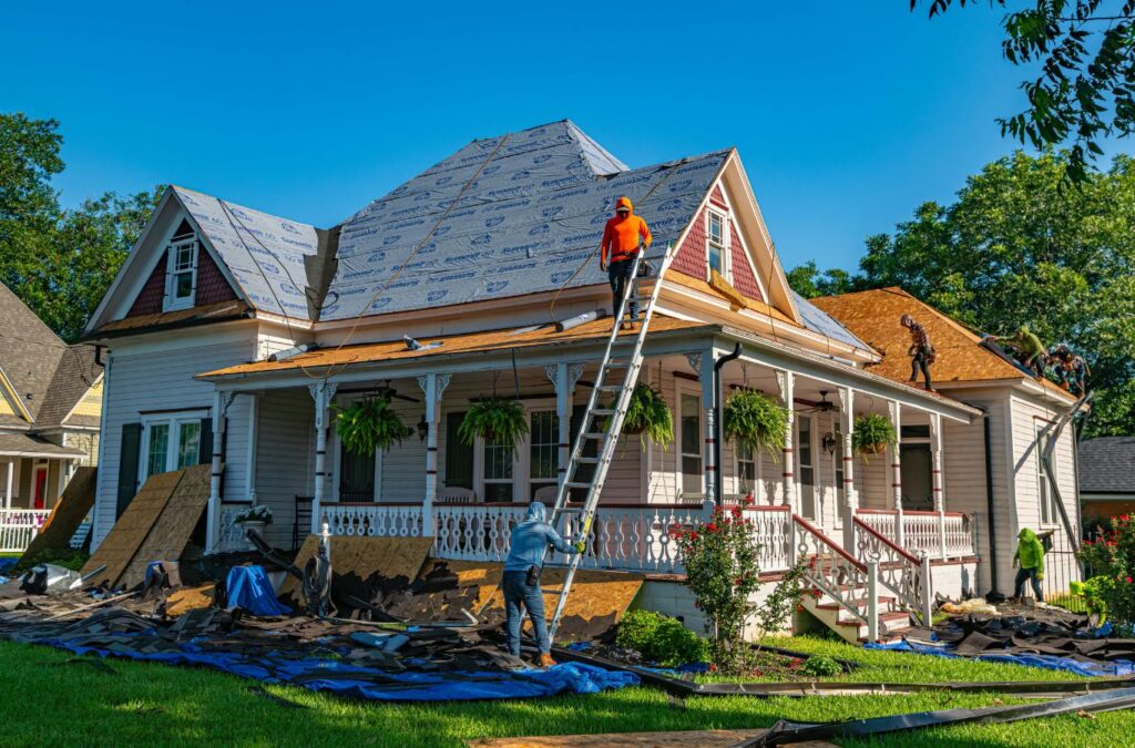 Strive Roofing & Construction crew replacing roof in Spring, TX using advanced tools for strong and durable results